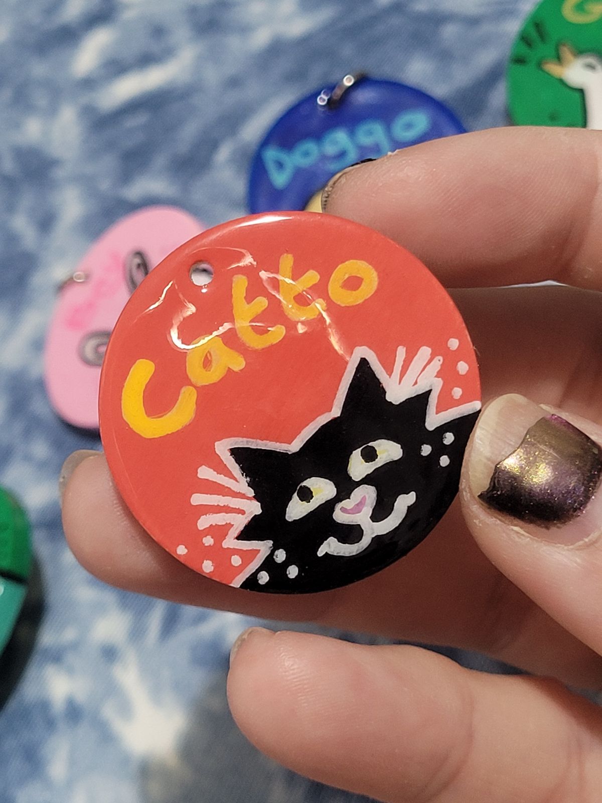 Catto Cute black cat badge with 'Catto' written above.