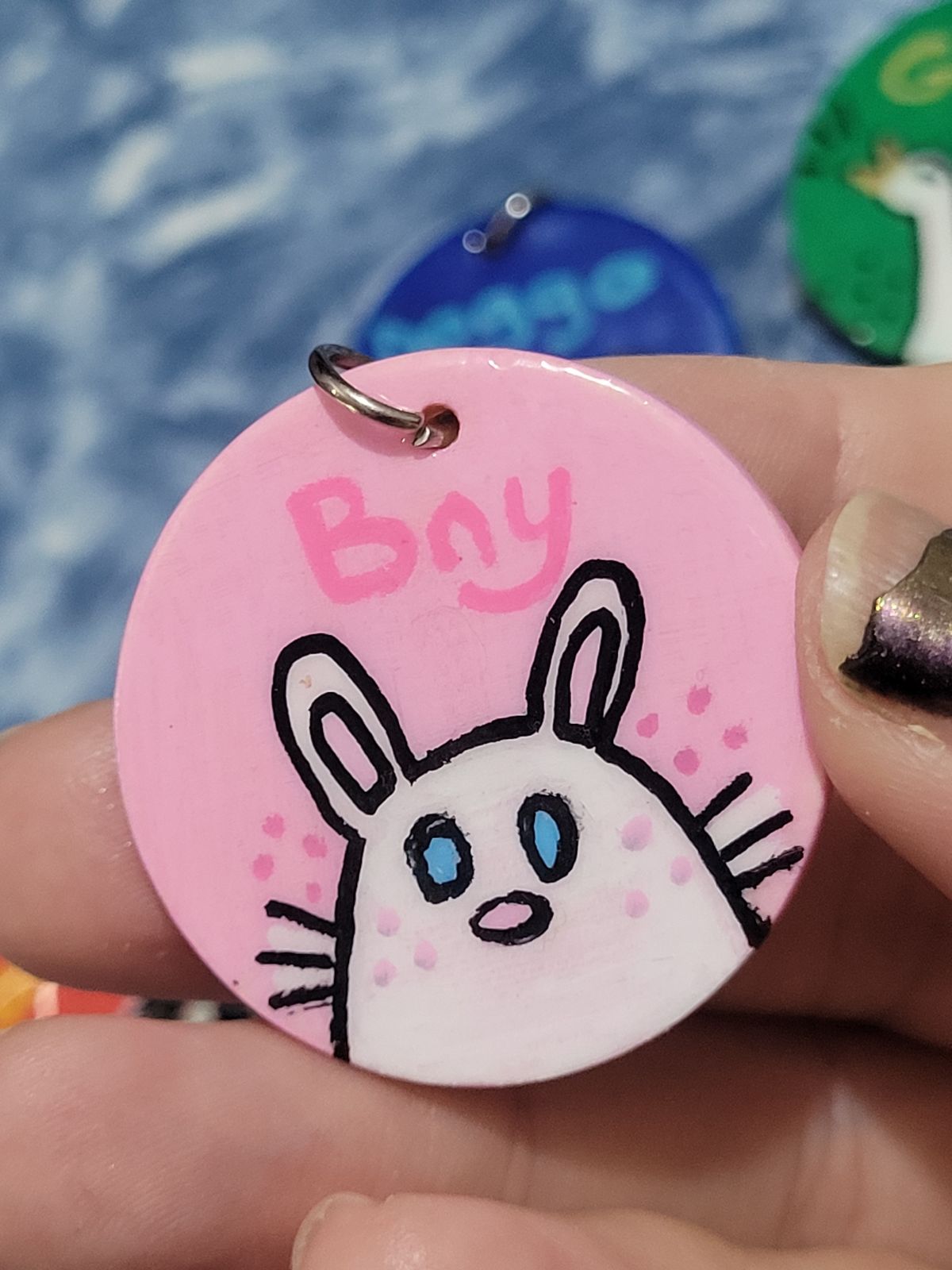 Bny Cute white rabbit on a badge with 'Bny' written above in pink.